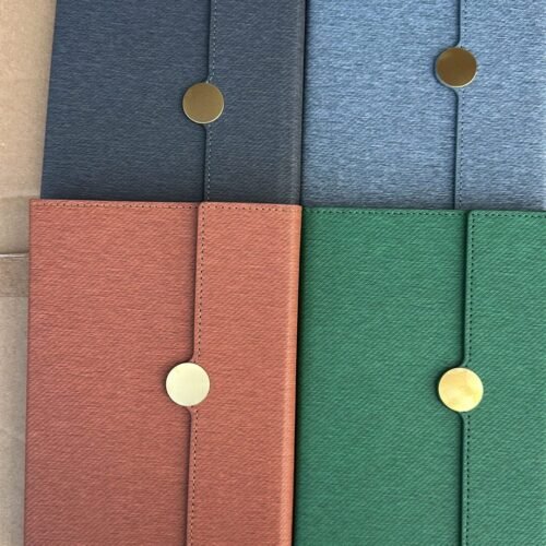 Hard cover notepad with gold buttom